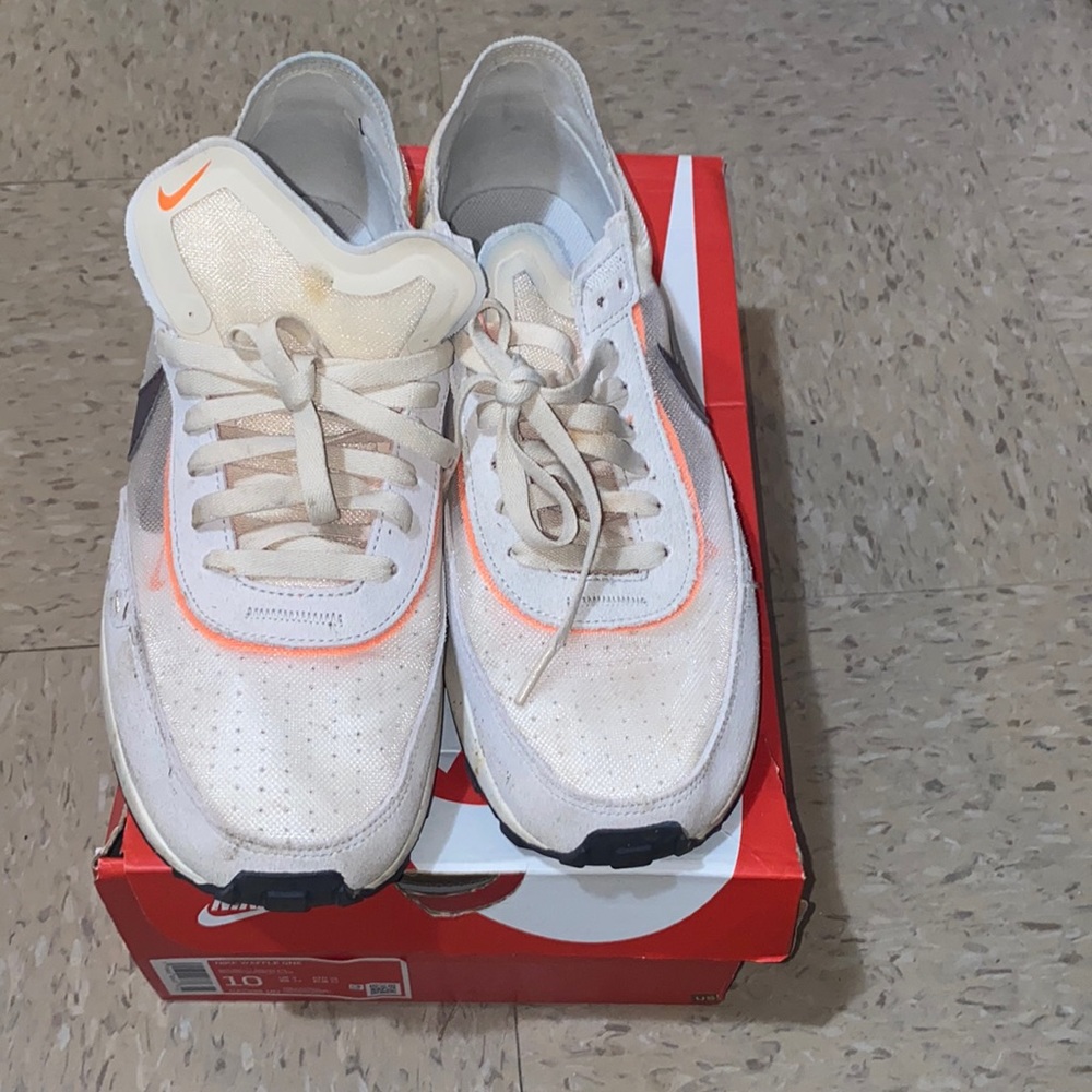 These are men Nike Waffle One . They’re a size 10. colors white, orange, brown